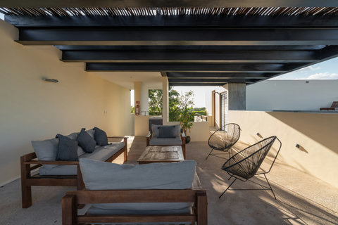 Unwind in this peaceful poolside area featuring cozy chairs and a calming atmosphere. It’s an ideal space to sunbathe, read, or simply relax outdoors while enjoying the quiet, refreshing surroundings.