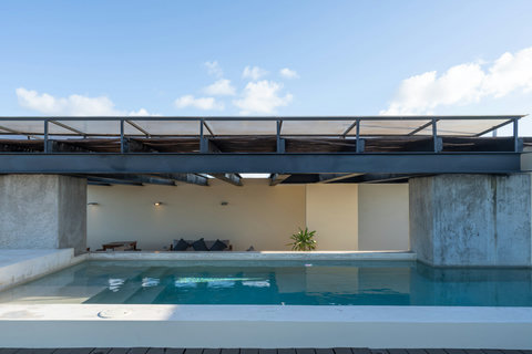 Enjoy a serene rooftop pool with crystal-clear water and wide-open views. Perfect for sunbathing, gentle swims, or simply unwinding in a peaceful and refreshing outdoor atmosphere.