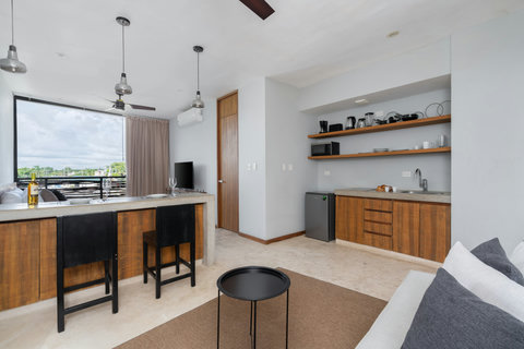 Enjoy this bright kitchen and dining space with large windows and modern essentials—a perfect spot to cook, share meals, and relax in comfort.