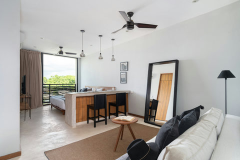 Enjoy a bright, stylish studio with a comfortable living area, spacious dining island, and lovely views—a refreshing space designed for relaxation and ease.
