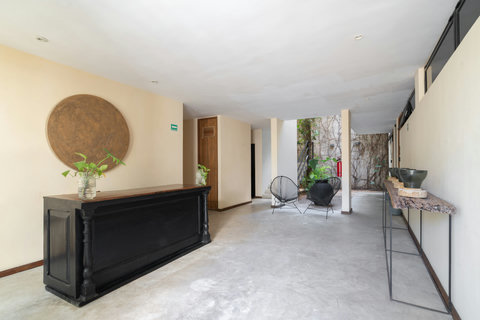 A small, inviting lobby with cozy details and a pleasant atmosphere, designed to make every guest feel welcome and comfortable upon arrival.