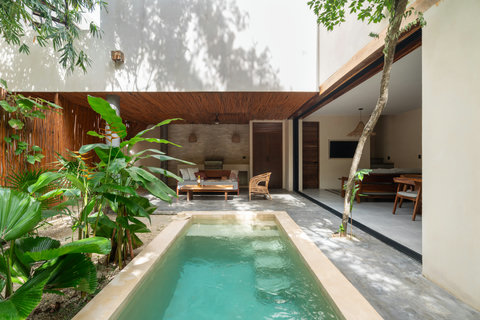 Enjoy seamless indoor-outdoor living with an open patio, private pool, and lush tropical surroundings. A harmonious space where modern comfort meets ultimate relaxation.
