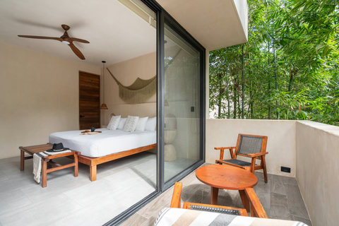 King bedroom with direct access to a private balcony, offering fresh air, natural light, and a peaceful space to unwind.