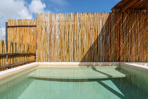 Enjoy sunlit serenity at our private pool, where every moment is infused with warmth, calm, and rejuvenation for a truly relaxing escape.