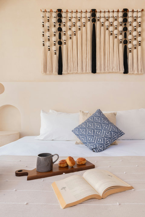 Sink into a plush king-size bed surrounded by handcrafted décor, soft textures, and calming neutral tones designed for peaceful and restorative nights.