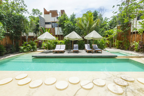 Relax by our stunning pool, surrounded by elegant details and lush nature. A serene retreat where every moment is peaceful, providing a perfect escape from daily life.