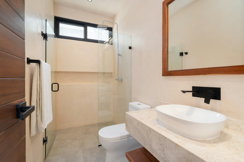 Refresh in this modern bathroom featuring a spacious walk-in shower, elegant stone finishes, and a clean minimalist design for a spa-like experience.