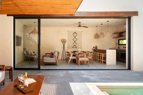 Step into a beautifully designed tropical retreat with seamless indoor-outdoor living, a private plunge pool, cozy lounge spaces, and a modern open kitchen.