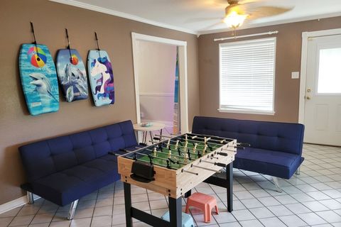 Family Room with Two Twin Futons, 10-Game Table, and Body Boards for Beach