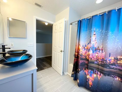 Upstairs, Disney-themed bath room with dual vanities.