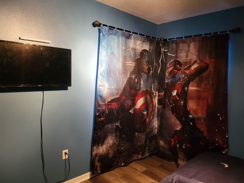 Upstairs, Avengers-themed bedroom with two twin-beds, touchable night light with USB ports, and a smart TV.