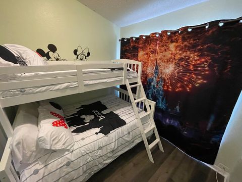 Downstairs, Disney-themed bedroom with twin-over-full bunkbed.