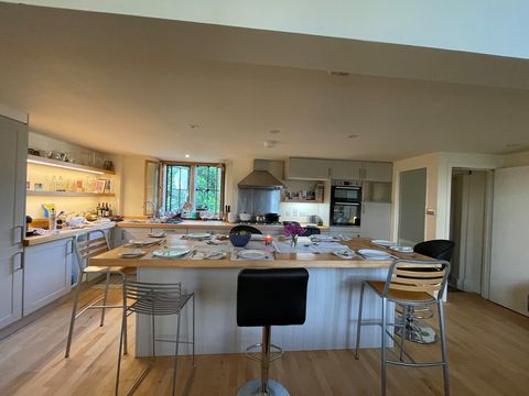 Our kitchen island serves as a dining table and comfortably seats eight. 