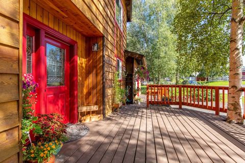South-facing entryway shaded by a large Birch tree. Enjoy the front deck in the mornings through afternoons.