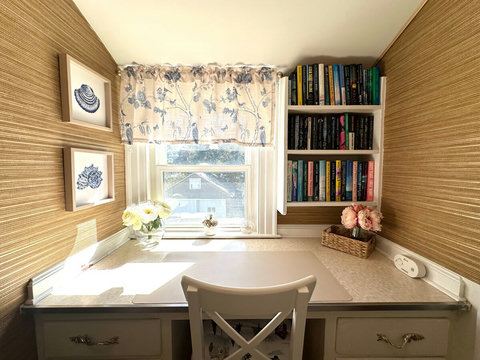 A built in desk in the upstairs hallway is an ideal spot for work, trip planning or a puzzle. 