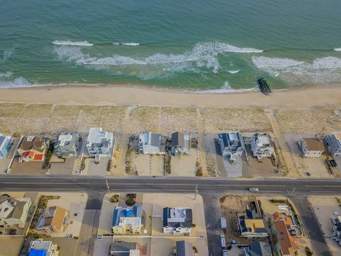 Right across the street from the ocean, this is a beautiful home to relax and enjoy ocean views from all 3 decks.  The entrance to the guarded beach (through Labor Day weekend) is just to your left, with 10 beach badges provided.    