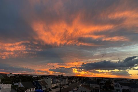 Sunsets can be spectacular off the roof deck, especially with your favorite beverage! 