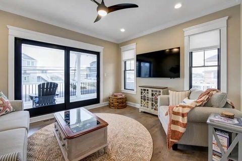 family room with sliders to 1st floor front deck