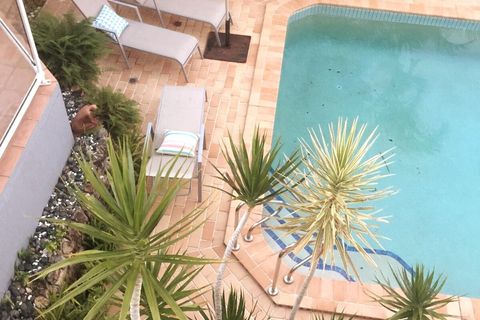 Pool with banana lounges.