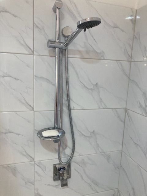 Shower with detectable multi function shower head.
