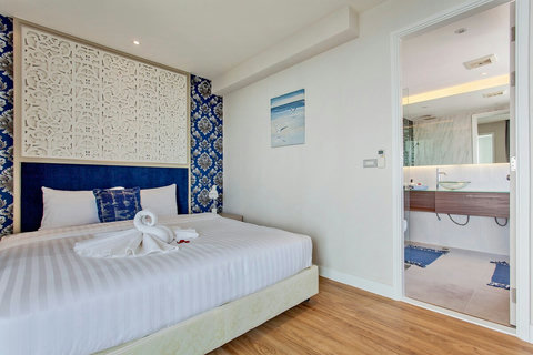 Master bedroom with the private bathroom and entrance to the huge balcony