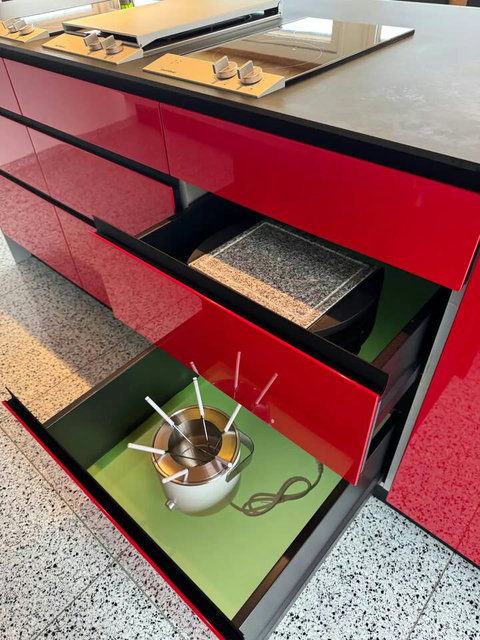 Gourmet Ready. Cutlery, cooking utensils, and essentials are neatly organized in the sleek, custom cabinetry. Ensures seamless meal prep for your chef or your group!