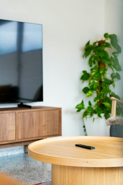 Modern Comfort & Entertainment.  Enjoy downtime with the large Smart TV and high-speed Wi-Fi, set atop stylish, custom wood furniture. Relax with seamless indoor entertainment