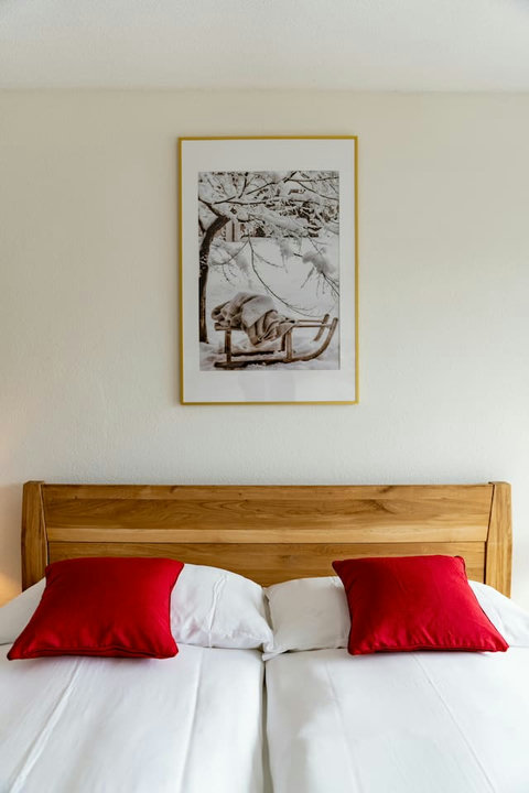 Bedroom 1 offers versatile sleeping arrangements with a Queen-size bed and a double bunk bed, comfortably accommodating up to 4 guests. For added relaxation and style, the room also features a cozy hammock