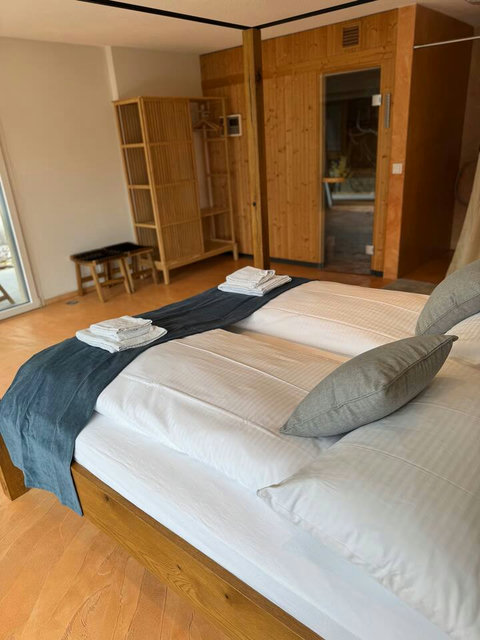 Spacious and Tidy Room. Ample integrated storage and a comfortable double bed ensure a clutter-free stay. Ideal for longer visits in the Swiss Alps region.