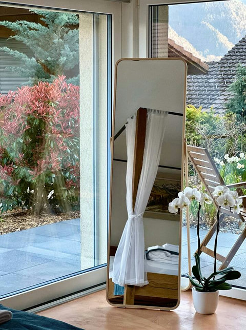 Bedroom with the Private Finnish Sauna.  Unwind in your exclusive Finnish Sauna, with a refreshing view of the tranquil garden. The ultimate luxury for relaxation and rejuvenation during your Swiss Dream Living escape