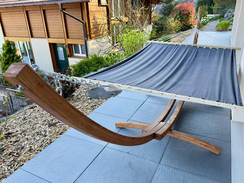 Your Private Relaxation Station.  Sink into this sturdy, comfortable hammock on the secluded terrace. Perfect for an afternoon nap, reading, or simply enjoying the peaceful atmosphere of your Swiss Dream Living retreat.