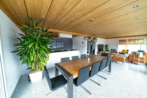 Gourmet Open-Concept Living. ✨ Seamlessly integrating the modern gourmet kitchen with the elegant dining area. Perfect for group entertaining and enjoying your Swiss Dream Living culinary experience
