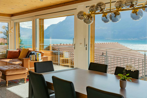 Open-Plan Social Hub!  The integrated dining and living areas provide a bright, luxurious space for your group to gather, cook, and relax. Enjoy the breathtaking Lake Brienz view from every angle.
