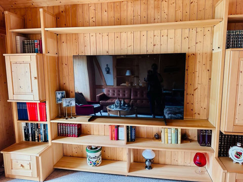 Comfortable living area with TV and warm chalet interiors