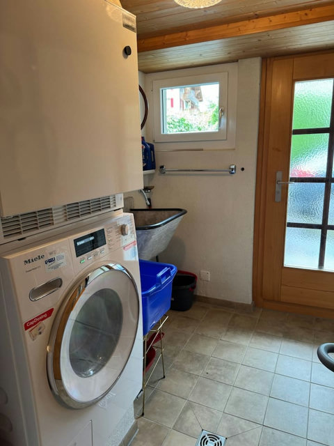 Laundry room with washing machine, dryer and utility sink