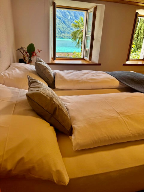 Comfortable bed setup with fresh linens, perfect for a relaxing night.