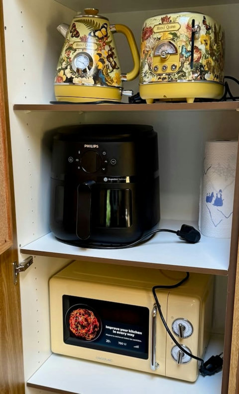 Well-equipped kitchen with an air fryer for added cooking comf