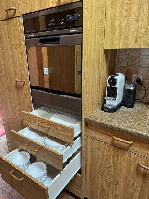Built-in oven, Nespresso coffee machine, milk frother, and generous storage for longer stays