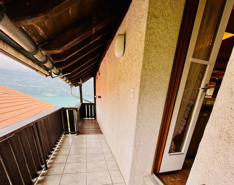 Spacious balcony with beautiful lake views for relaxing outdoors.