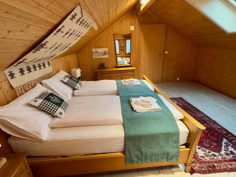 Spacious bedroom with a comfortable bed and beautiful lake views.