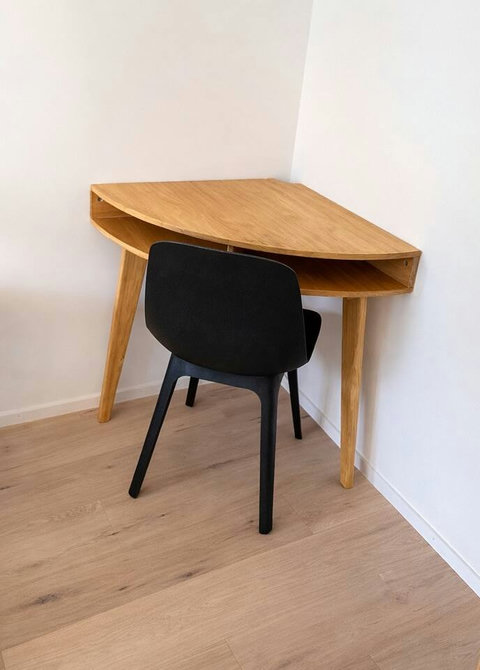 A compact work desk with a comfortable chair, ideal for remote work or planning your day.