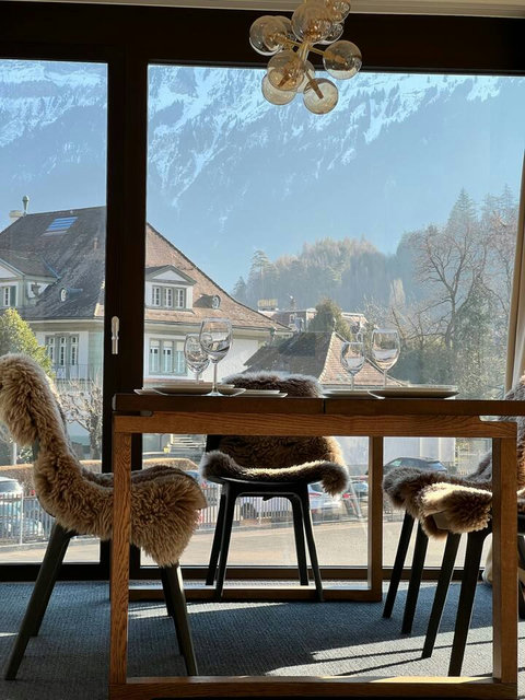 Enjoy breakfast or sunset wine by the window with charming village views and a relaxed Swiss alpine feel.