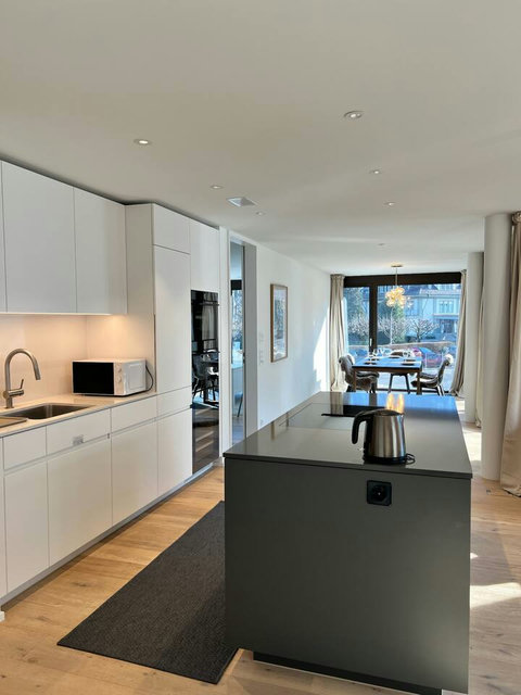 Modern open kitchen with island and natural light ✨ Fully equipped for easy cooking, featuring clean design, quality appliances, and a seamless flow into the dining area
