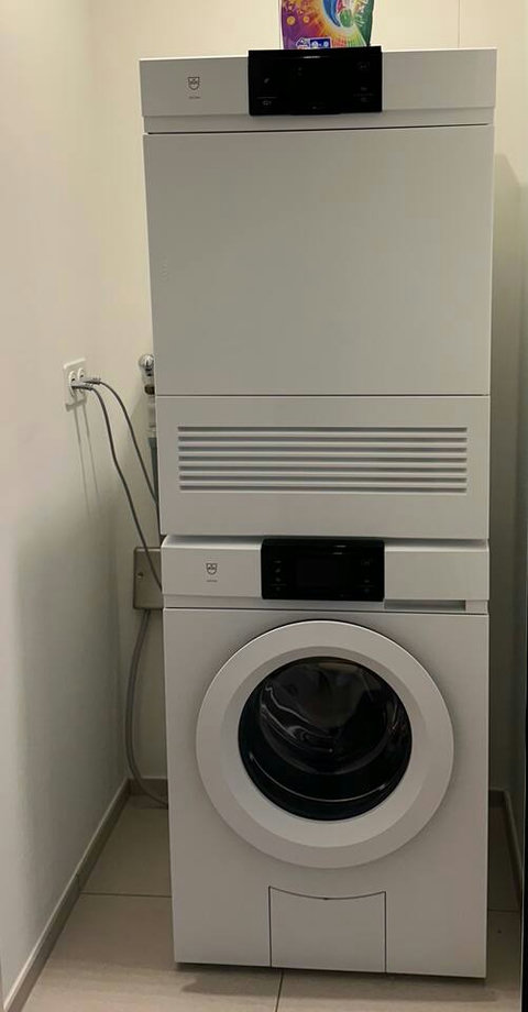 In-apartment washing machine and dryer for longer or family stays.