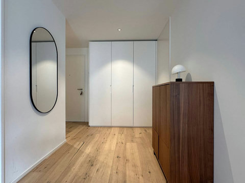 Spacious entryway with built-in storage and warm wood floors—easy arrival and plenty of room to settle in.