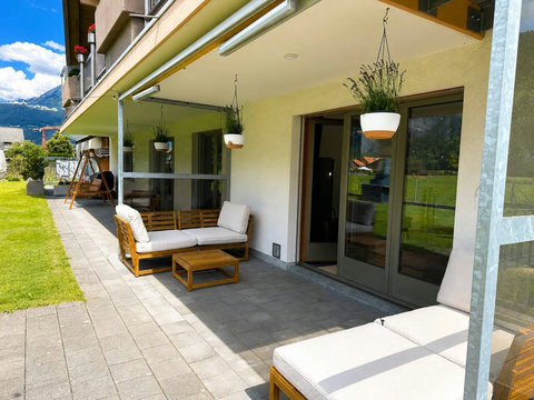 Manor 2 terrace at Chalet Swiss Dream Manor — private outdoor seating, fresh alpine air and a peaceful Meiringen setting for relaxed family mornings.