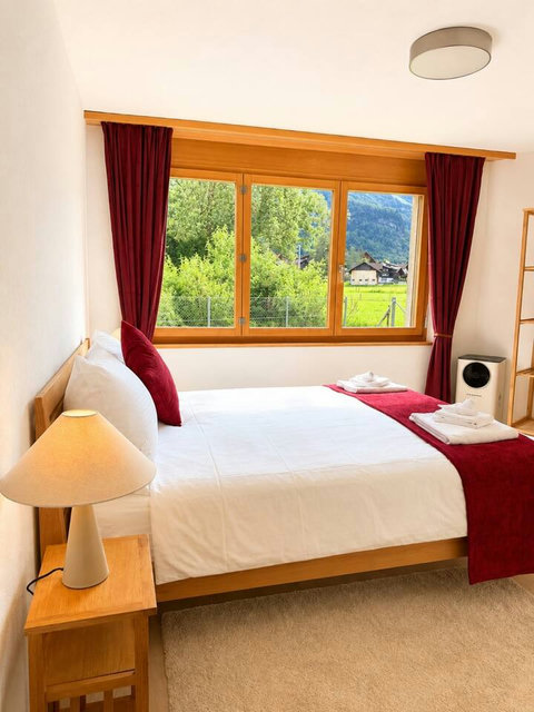 Manor 2 Bedroom 3 at Chalet Swiss Dream Manor — bright comfort, soft linens and beautiful Meiringen mountain views for restful family stays.