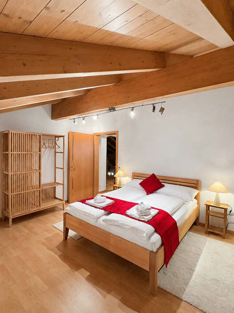 Manor 1 bedroom at Chalet Swiss Dream Manor — warm wood ceilings, soft linens and peaceful alpine comfort for restful family stays.