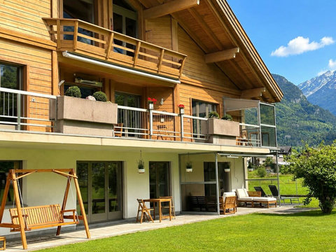 Chalet Swiss Dream Manor in Meiringen — a private Swiss Alps retreat with balconies, garden space and mountain views, ideal for large families and groups up to 18.