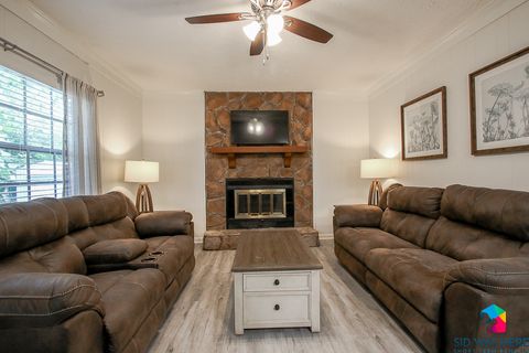 Living Room with reclining couches | Celling Fan | Smart TV
